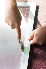 The craftsmen are doing mosquito wire screen on a white background