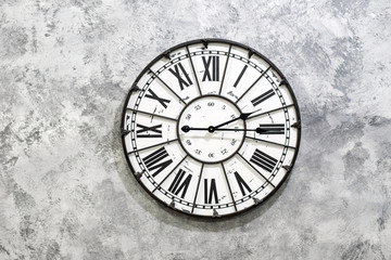 Old and Vintage clock on cement background