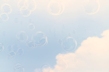 Soap bubbles in the air with cloud and blue sky on background, Outdoor activity funny and party