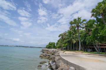 Bright scenic morning view of the boardwalk at Pattaya Beach in Thailand.