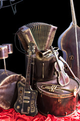 Old vintage musical instruments on a black background. Classical music instrument