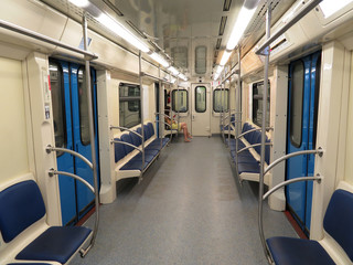 Interior of the Moscow metro car. Subway car with alone passenger
