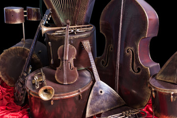 Old vintage musical instruments on a black background. Classical music instrument