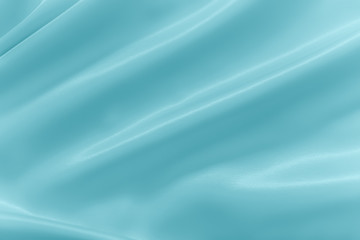 Smooth elegant shiny turquoise silk or satin luxury cloth texture can use as abstract holidays background. Luxurious Christmas background or New Year background design.
