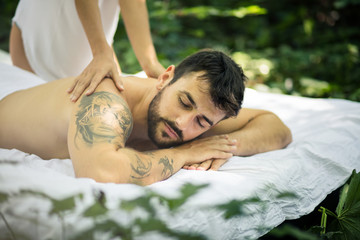 Obraz na płótnie Canvas Close up image of young men at massage treatment.