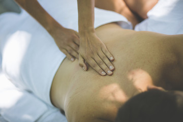 Women massage young men.