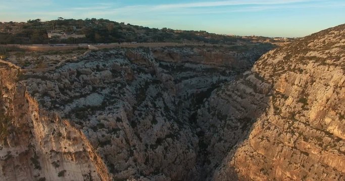 Aerial shot of European Maltese Cliffs during Sunset
