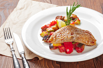 Roasted duck breast with vegetable salad close up