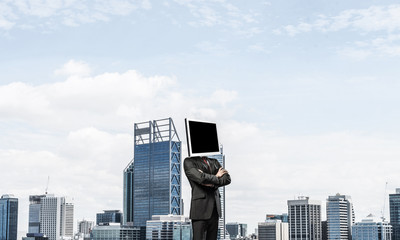 Businessman with monitor instead of head.