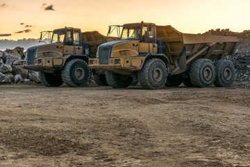 Obraz premium Large trucks in an open pit mine