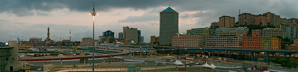 Panoramic view of the city of Genoa at sunset, with the Lantern in the distance