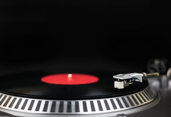 Professional party djs turntable close-up shot. Analog stage audio equipment for concert in nightclub. Play mix music tracks on vinyl records. Turntables needle cartridge scratches vinyl disc. DJ