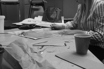 a girl drawing on a table