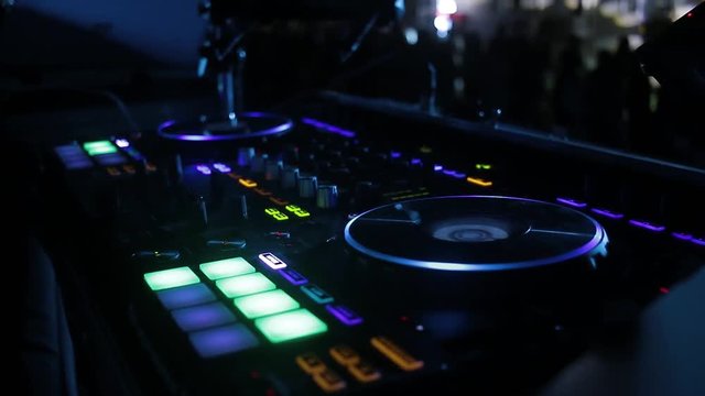 Dj playing on pioneer controller