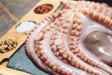 Octopus. Seafood in the restaurant. Octopus is prepared in the restaurant on the table.