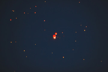 Flying lantern in the dark sky