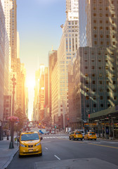Fototapeta na wymiar A street New York city with yellow cabs