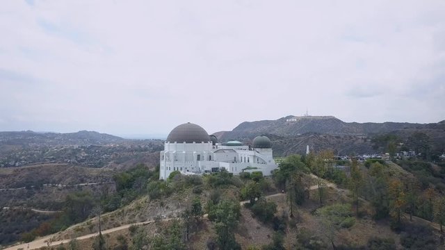 Aerial view of the Griffith observatory with the Hollywood sign in the background