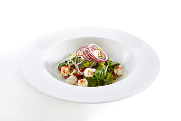 Salad with Goat Cheese, Spinach, Tomato and Onions Isolated