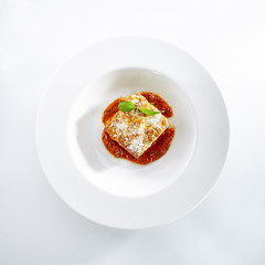 Lasagna with Tomato Sauce Isolated on White Background