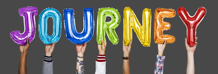 Hands showing journey balloons word