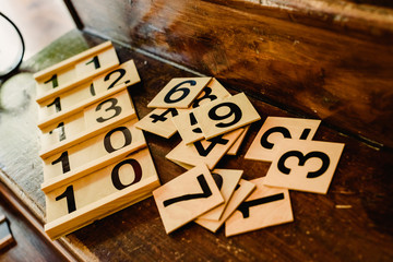 Wooden numbers in tables to learn mathematics in a Montessori classroom.