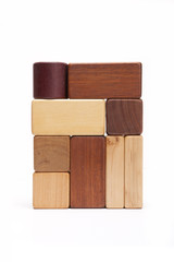 wood block make a something stacked  isolated white.
