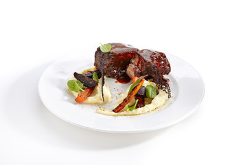 Veal Cheeks and Baked Seasonal Vegetables Isolated