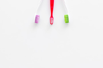 Clean teeth. Toothbrushes on white background top view copy space