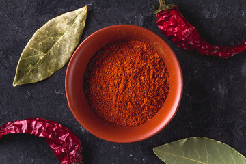 Spicy, tasty, spices and red, dried pepper on a dark background