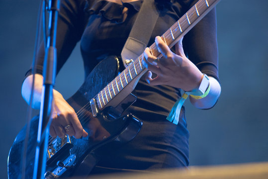 Musician's hands playing electric guitar