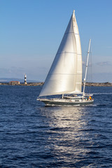 Fototapeta premium Sailboat sailing in the evening
