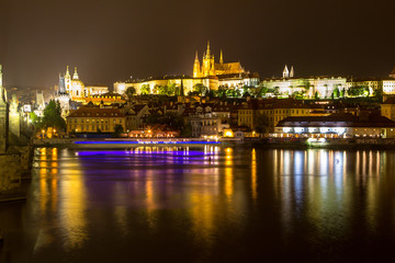 Naklejka na ściany i meble Prague castle and the Charles bridge at dusk