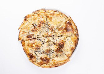 a turkish pide on white background from top view