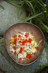 Crab salad with cucumber and caviar