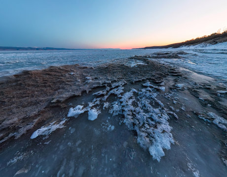 Dawn on a sandy beach on the island of Olkhon. Wide-angle panorama