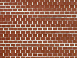 Wall background of perfectly lined up red bricks