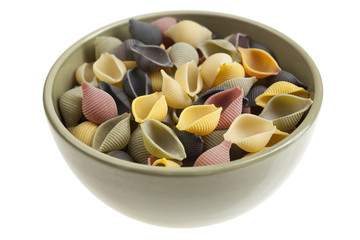 Cup with five color shell pasta isolated on white background