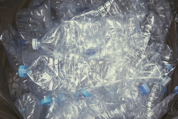 Plastic bottle in garbage bag for recycle and reduce ecology environment. concept save the earth.