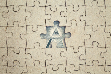 Missing jigsaw puzzle piece and dollar all-seeing eye . Business concept