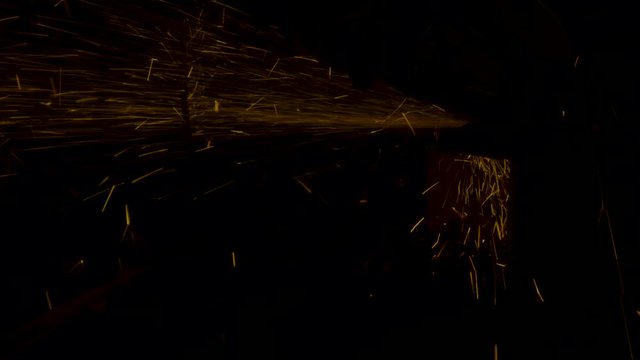 sparks effect - worker cutting iron