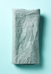Cotton napkin on blue, from above