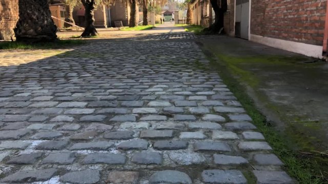 Cobblestone floor, patio and exterior construction of the abandoned asylum of the sisters of the poor located in santiago de chile