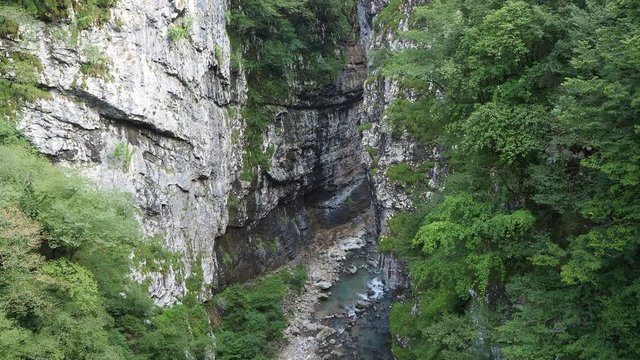Colore, Bergamo, Italy. Dezzo creek at the bottom of steep rock cliffs and mountain ravine. Shoot from Via Mala an historical route in Scalve Valley