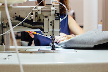 Woman works with sewing machine
