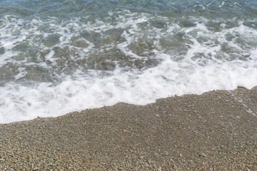Sea waves on pebbles.
