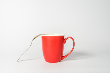 Red cup of coffee with milk. Cappuccino, latte.