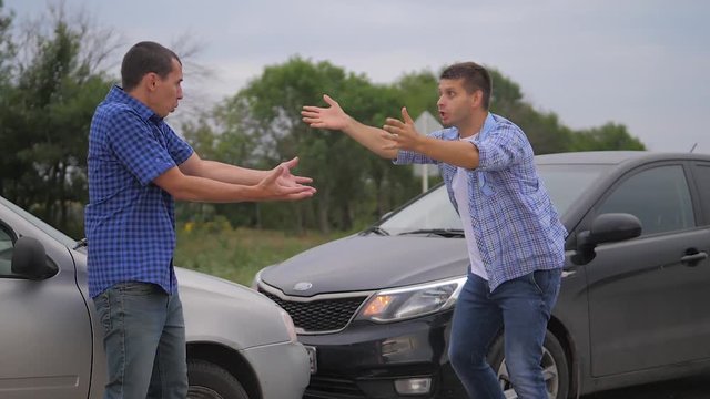 Two men arguing conflict after a car accident on the road car insurance. slow motion video. Two Drivers man Arguing After Traffic Accident. auto insurance accident lifestyle concept men. Two men