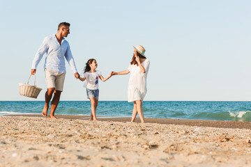 Young family having fun together at the beach.