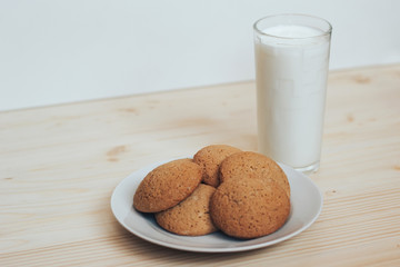 Cookies with a glass of milk on the table.